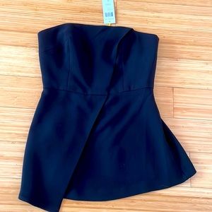 Brand new strapless top for evening in black color .